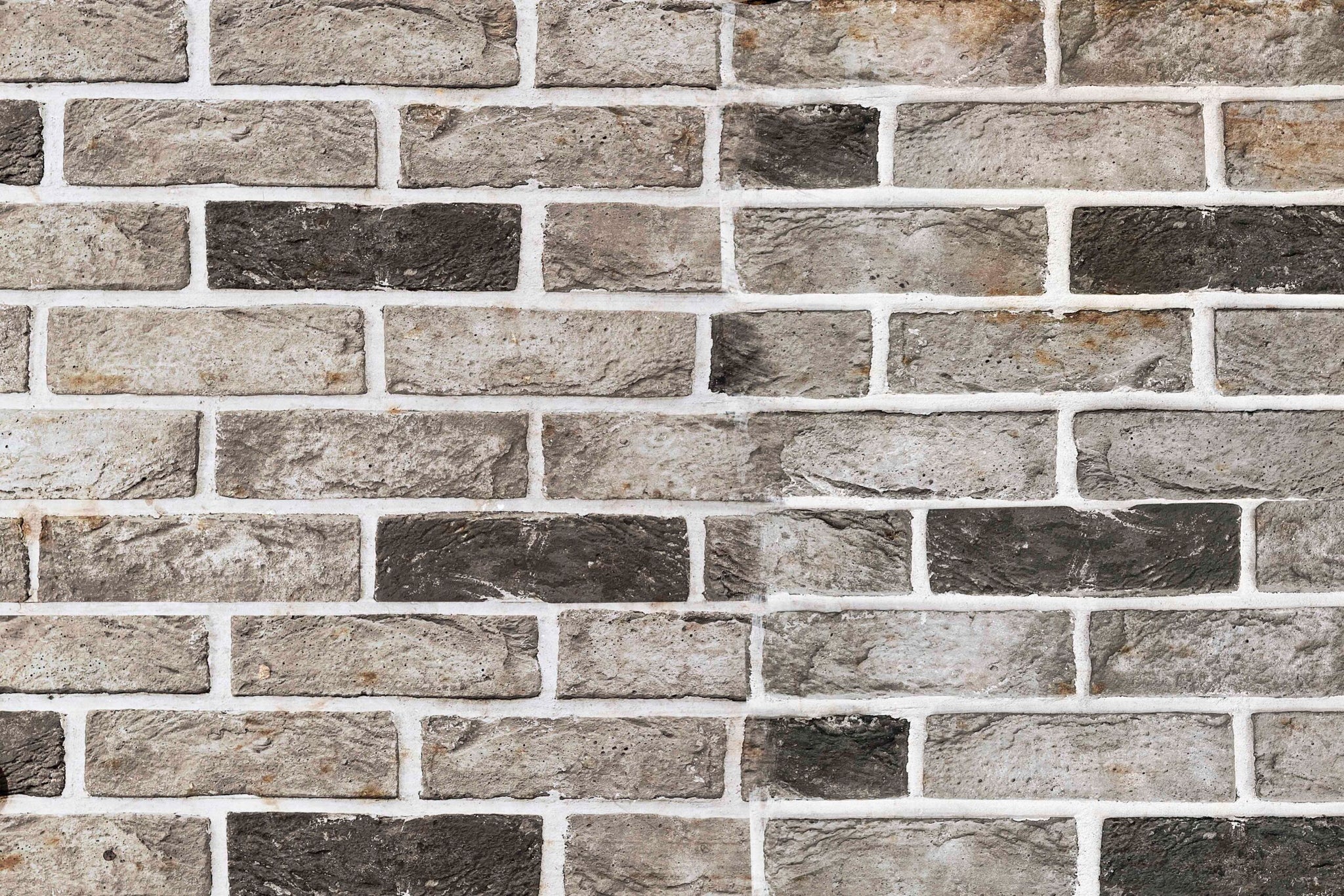 Grey and brown brick wall